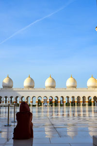 Rear view of man looking at temple