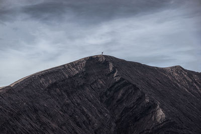 Low angle view of rock formations against sky