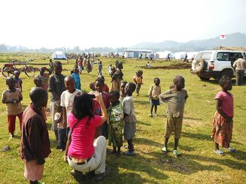 People playing soccer on field