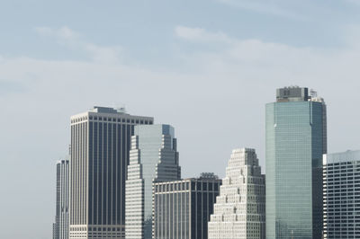 Skyscrapers in city against sky