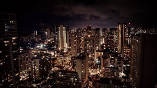 Illuminated cityscape at night