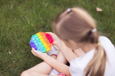 Low angle view of girl playing in field