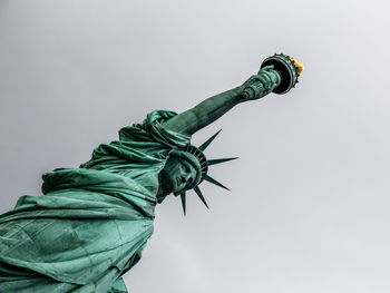 Low angle view of statue against sky