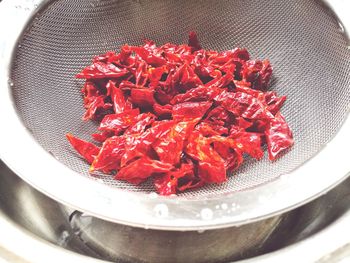 High angle view of red berries in plate