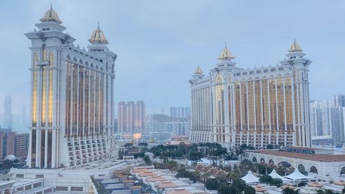 Buildings in city against sky