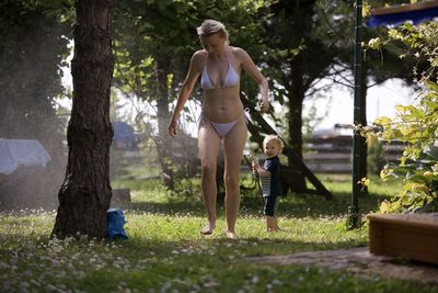 Full length of young woman standing in park