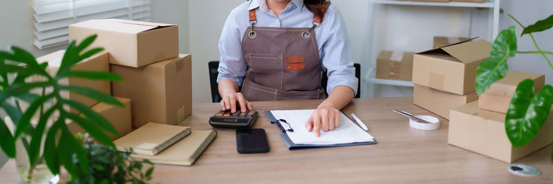 Midsection of man working in office