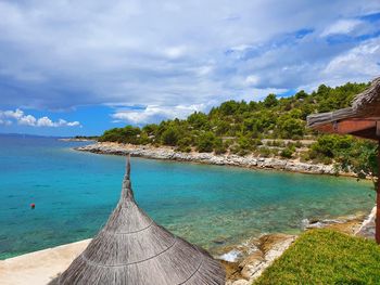 Scenic view of swimming pool by sea against sky