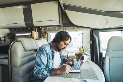 Portrait of woman sitting in bus