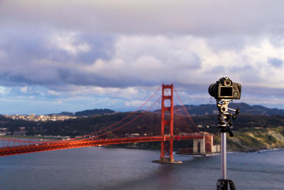 Golden gate bridge against cloudy sky