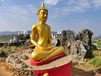 Large buddha statue against sky