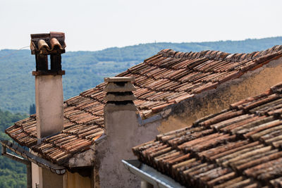 Roof of old building against clear sky