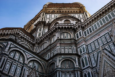 Low angle view of ornate building against sky