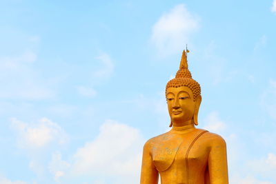 Low angle view of statue against sky