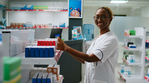 Portrait of young man standing in laboratory