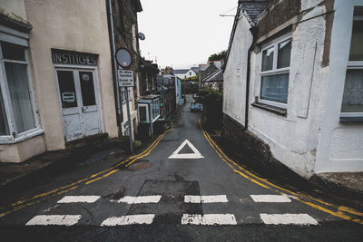 Road amidst houses