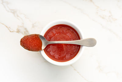 High angle view of strawberries in bowl on table