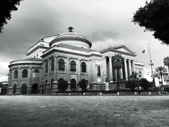 Low angle view of historical building against cloudy sky