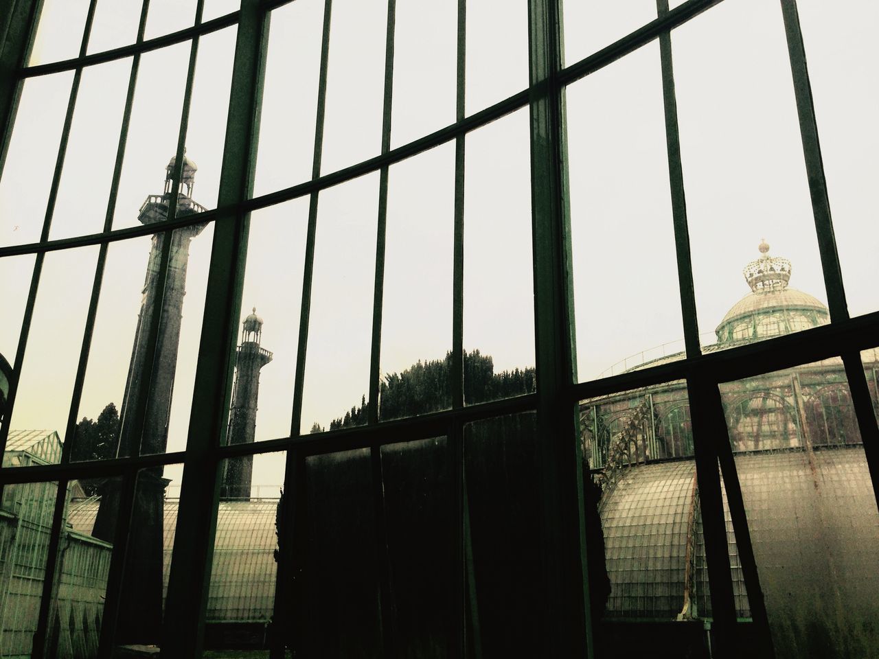 architecture, built structure, fence, protection, safety, chainlink fence, metal, building exterior, security, low angle view, window, sky, glass - material, metallic, day, no people, outdoors, pattern, clear sky, gate