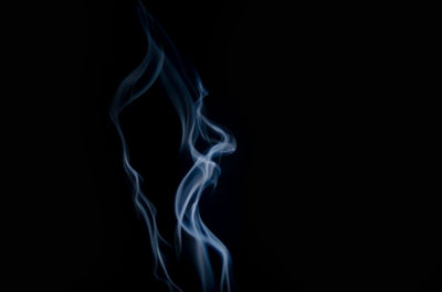 Close-up of smoke against black background