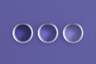 Directly above shot of fidget spinner against blue background