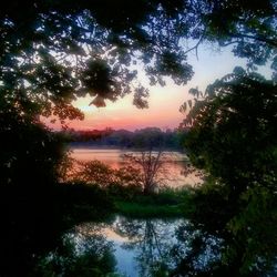 Scenic view of lake at sunset