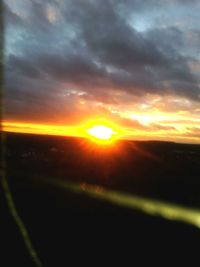 Scenic view of dramatic sky during sunset