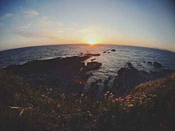 Scenic view of sea against sky during sunset