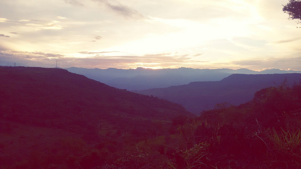 mountain, tranquil scene, scenics, tranquility, sunset, beauty in nature, sky, mountain range, landscape, silhouette, nature, idyllic, tree, cloud - sky, non-urban scene, cloud, remote, outdoors, dusk, no people