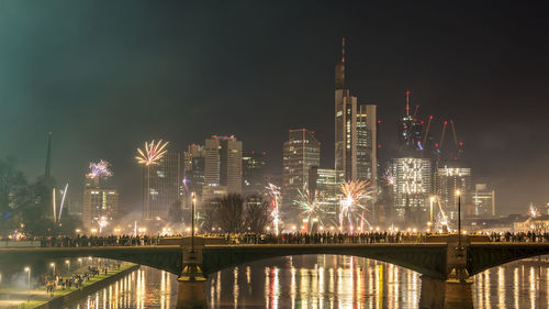 Illuminated buildings in city at night