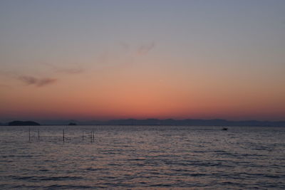 Scenic view of sea against sky at sunset