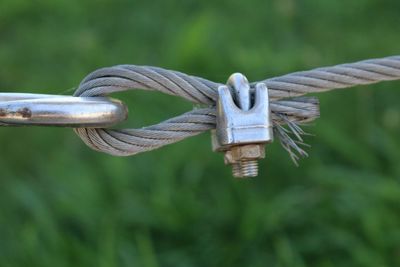 Close-up of steel cable over field