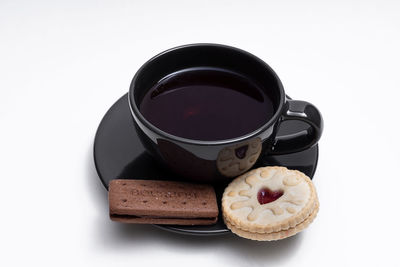 High angle view of coffee cup against white background