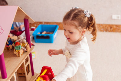 High angle view of cute baby girl at home