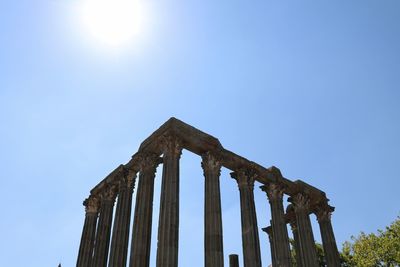 Roman temple of evora against clear blue sky on sunny day
