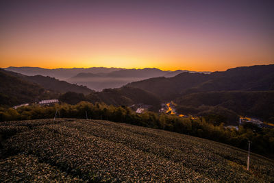 Scenic view of field against sky during sunset