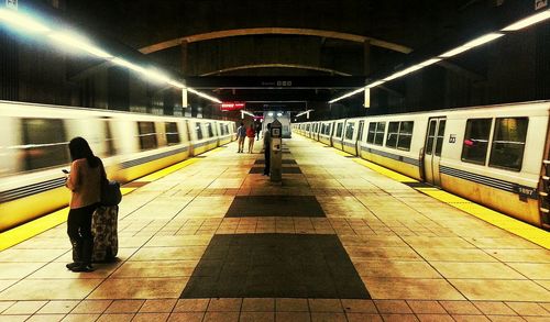 People walking in tunnel