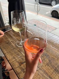 Close-up of hand holding wine glass