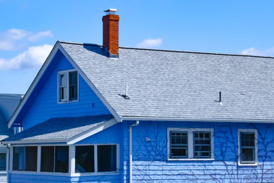 Low angle view of building against blue sky