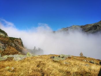 Scenic view of rocky mountains against clear blue sky