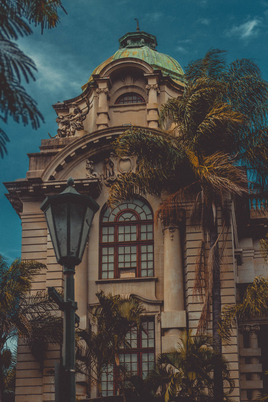 architecture, built structure, building exterior, tree, sky, building, landmark, plant, no people, nature, travel destinations, palm tree, low angle view, history, tropical climate, evening, the past, religion, city, outdoors, place of worship, travel, belief, cloud, tourism