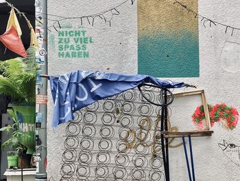 Low angle view of clothes drying against building