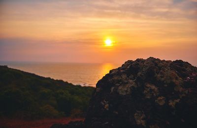 Scenic view of sea against dramatic sky