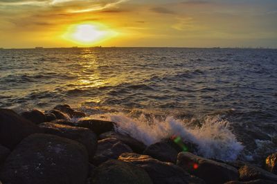 Scenic view of sea at sunset