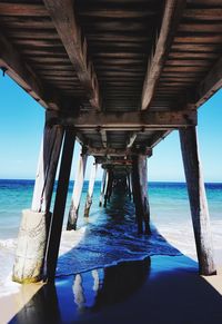 Pier over sea against sky