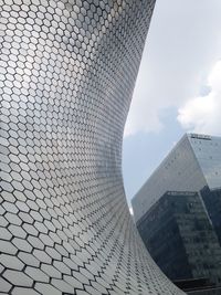 Built structure against cloudy sky