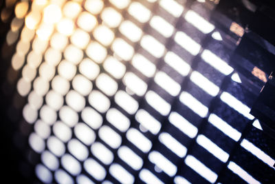 Full frame shot of illuminated metal grate