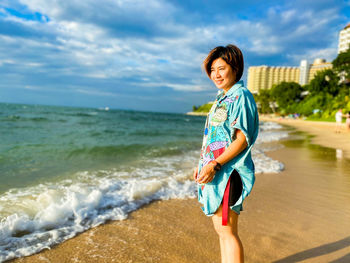 Full length of man standing on beach