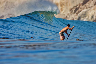 Man surfing in sea