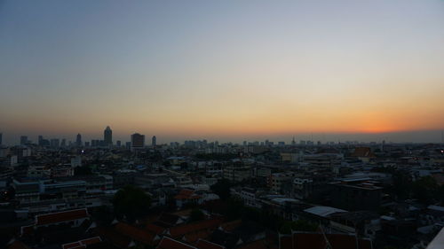 High angle view of buildings against sky during sunset